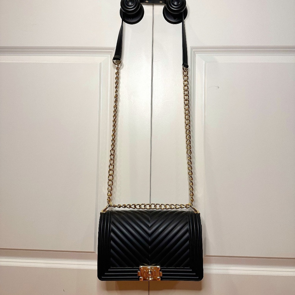 Black purse with gold chain